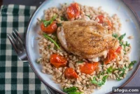 Pan-Seared Chicken Thighs with Farro and Burst Cherry Tomatoes