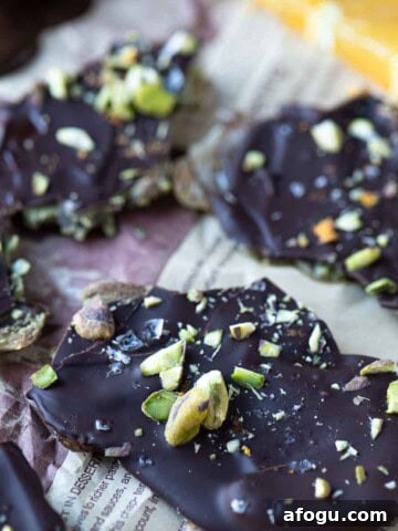 Close up or pistachio date bark on parchment.