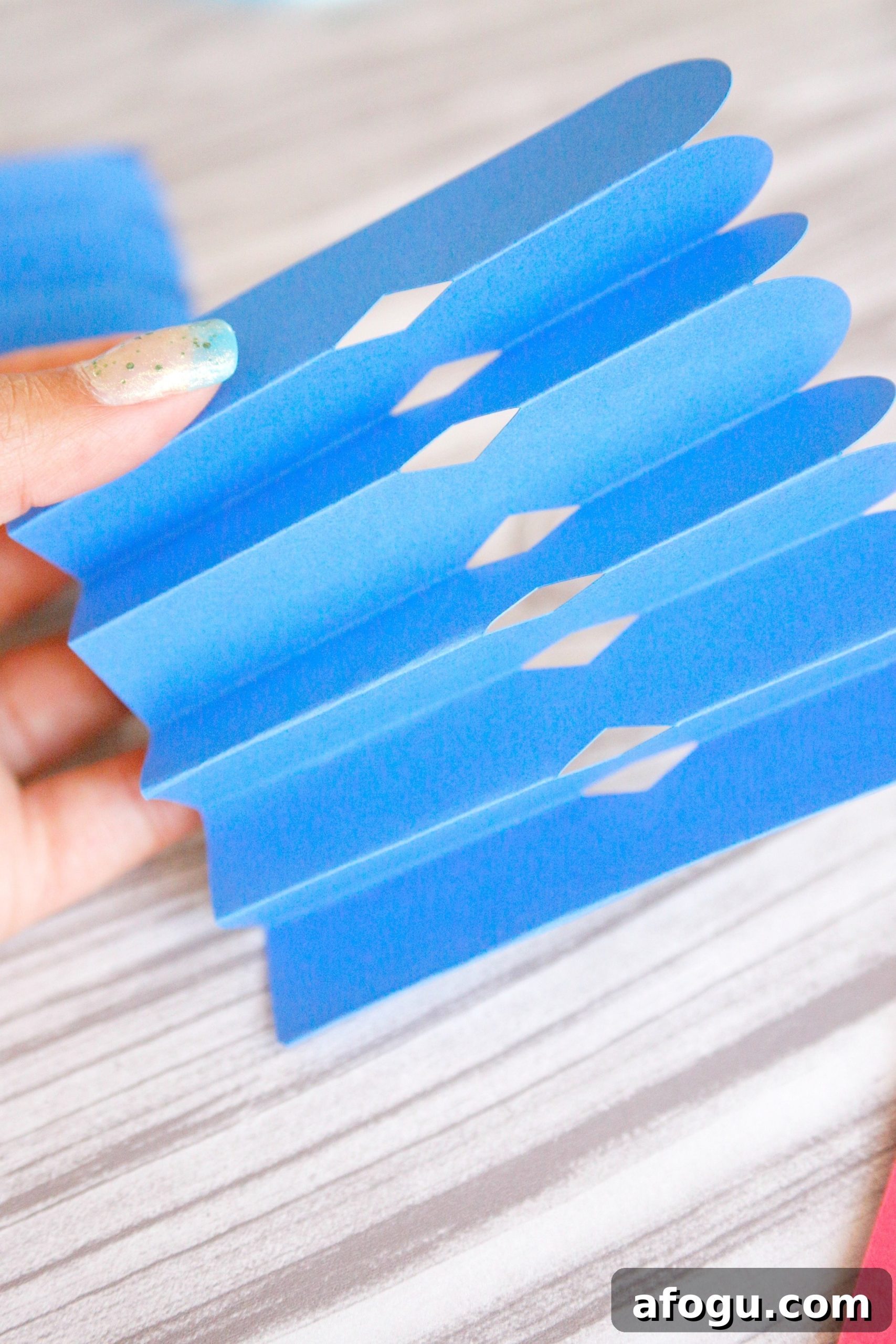 Scored paper folded into rosette sections.