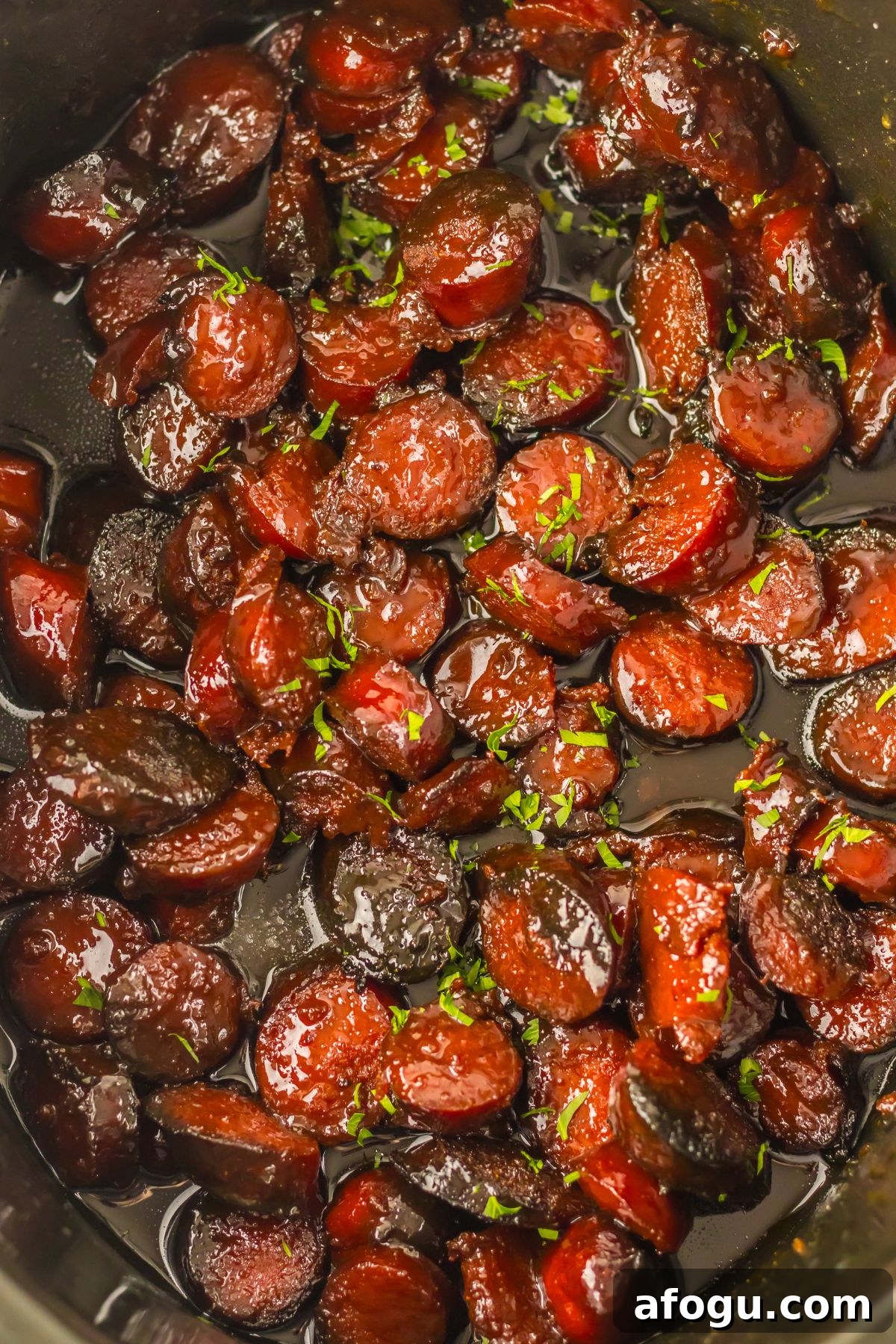 Cooked smoked sausage in a crock pot.