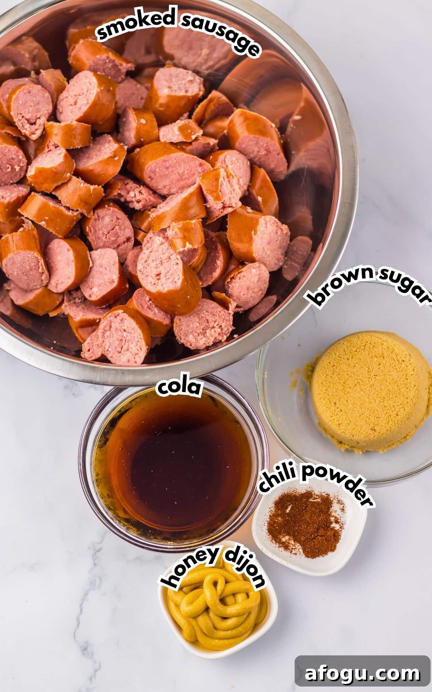 Bowls of ingredients labelled with text on a counter.