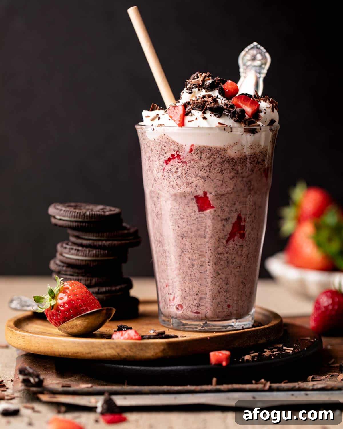 side shot of milkshake in a glass with whipped cream