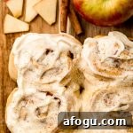 Aerial photo of apple cinnamon rolls on a cutting board.