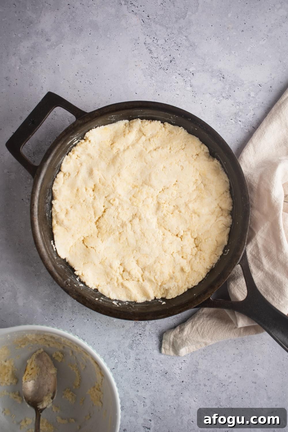 Cornbread dough in a skillet.