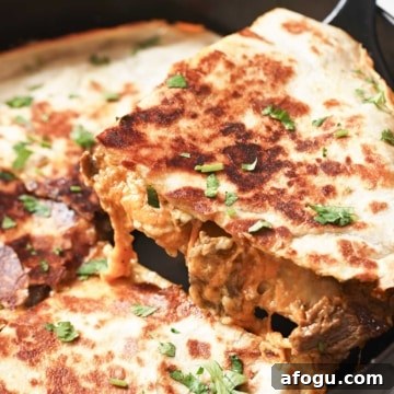 Carne asada quesadilla in a cast iron skillet.