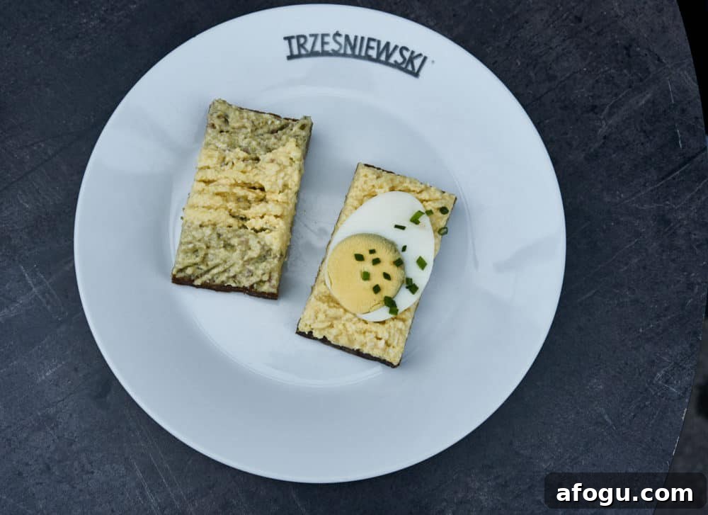 Top Vienna Markets: Where to Shop Local Food, Crafts & Gifts 7 A white plate with two Trzesniewski open-faced sandwiches with hard boiled egg and egg salad.