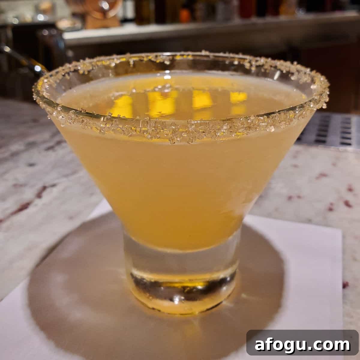 Alchemist Sidecar in a stemless martini glass with sugared rim
