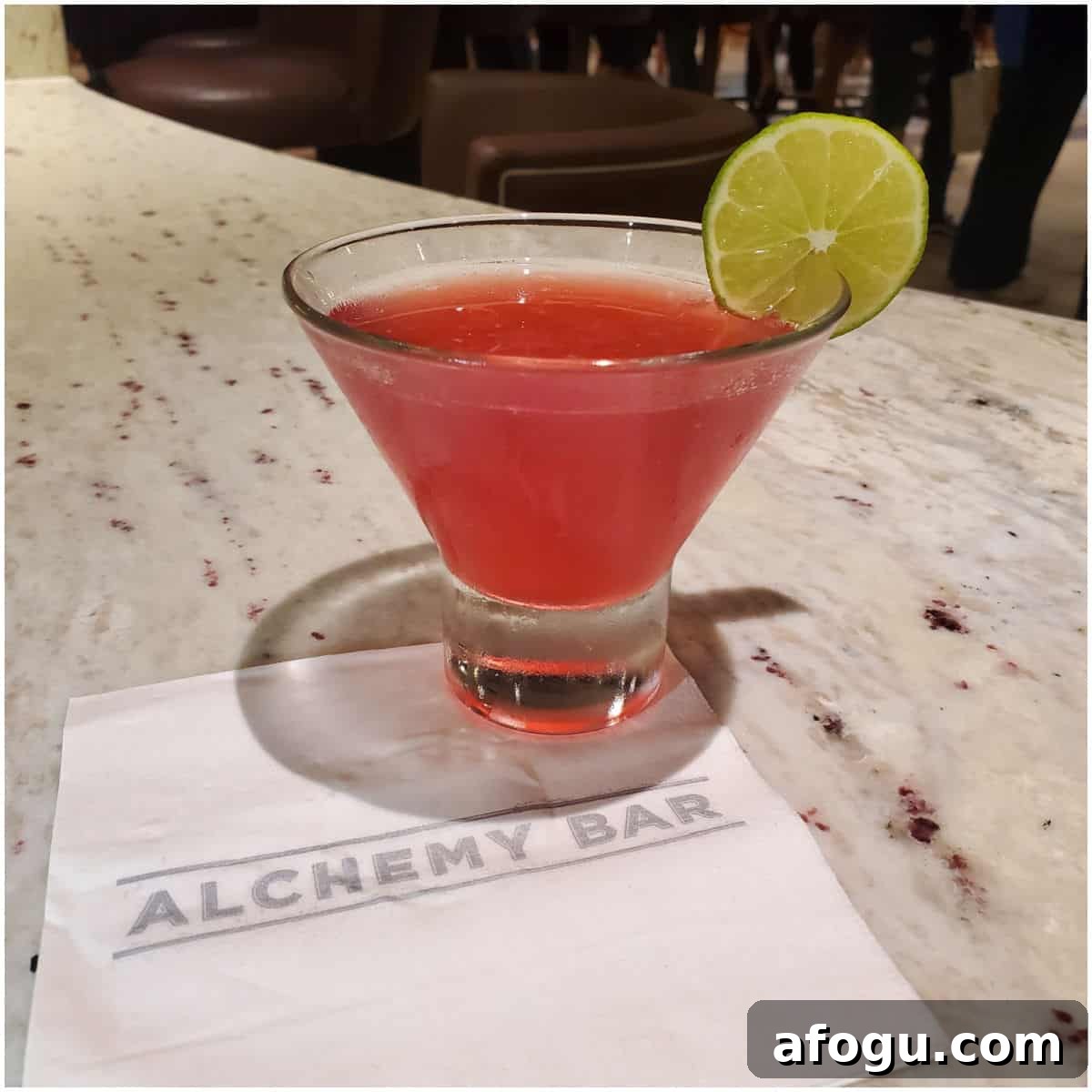 Pink 40 is the new 20 Cocktail with a lime wheel on an Alchemy Bar napkin