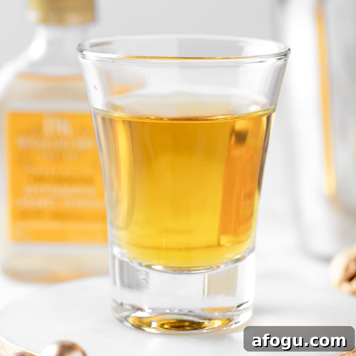 A Burt Reynolds shot with a bottle of butterscotch schnapps in the background.