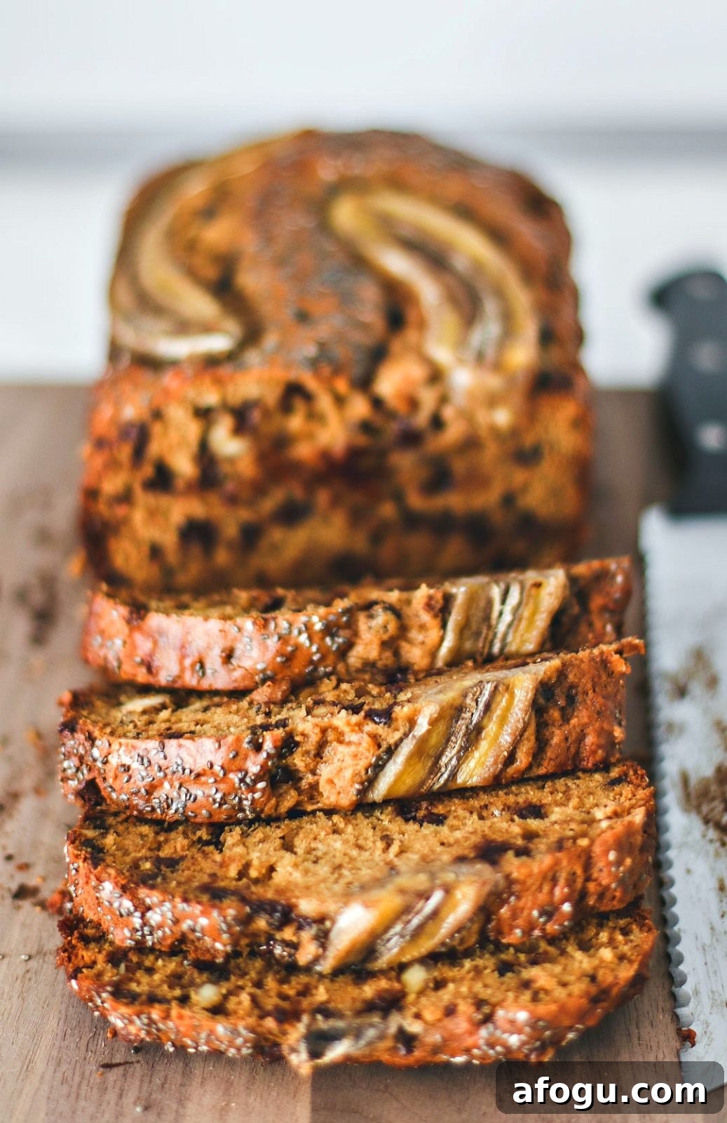 Walnut Chocolate Chip Banana Bread with Sour Cream Swirl 7 Walnut Chocolate Chip Banana Bread cut into slices.
