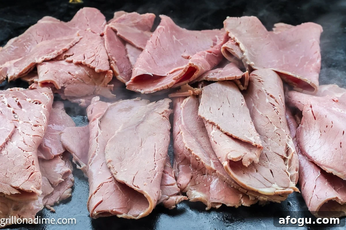 Sliced corned beef on the griddle