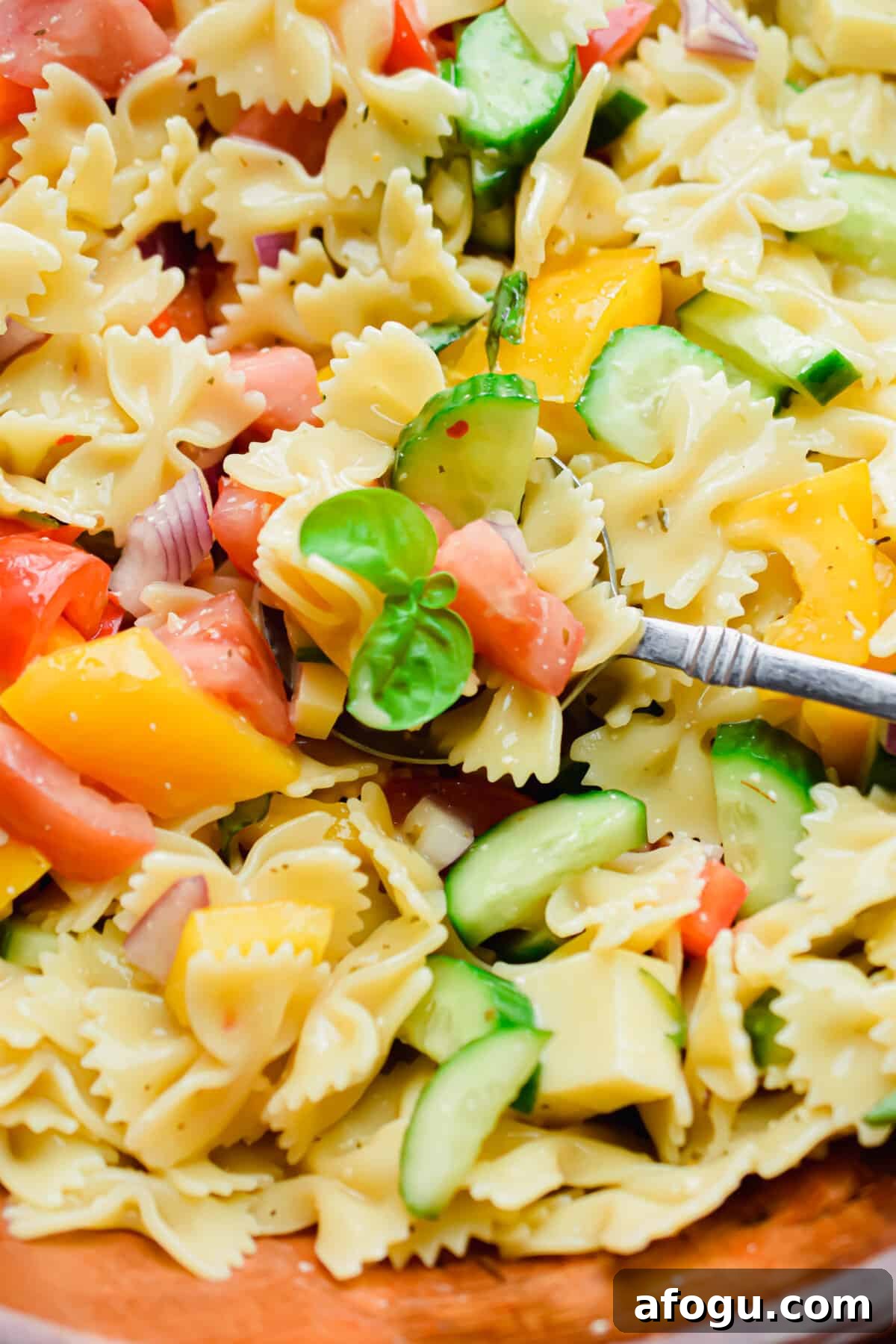 The ingredients of the Bowtie Pasta Salad with Italian Dressing are shown.
