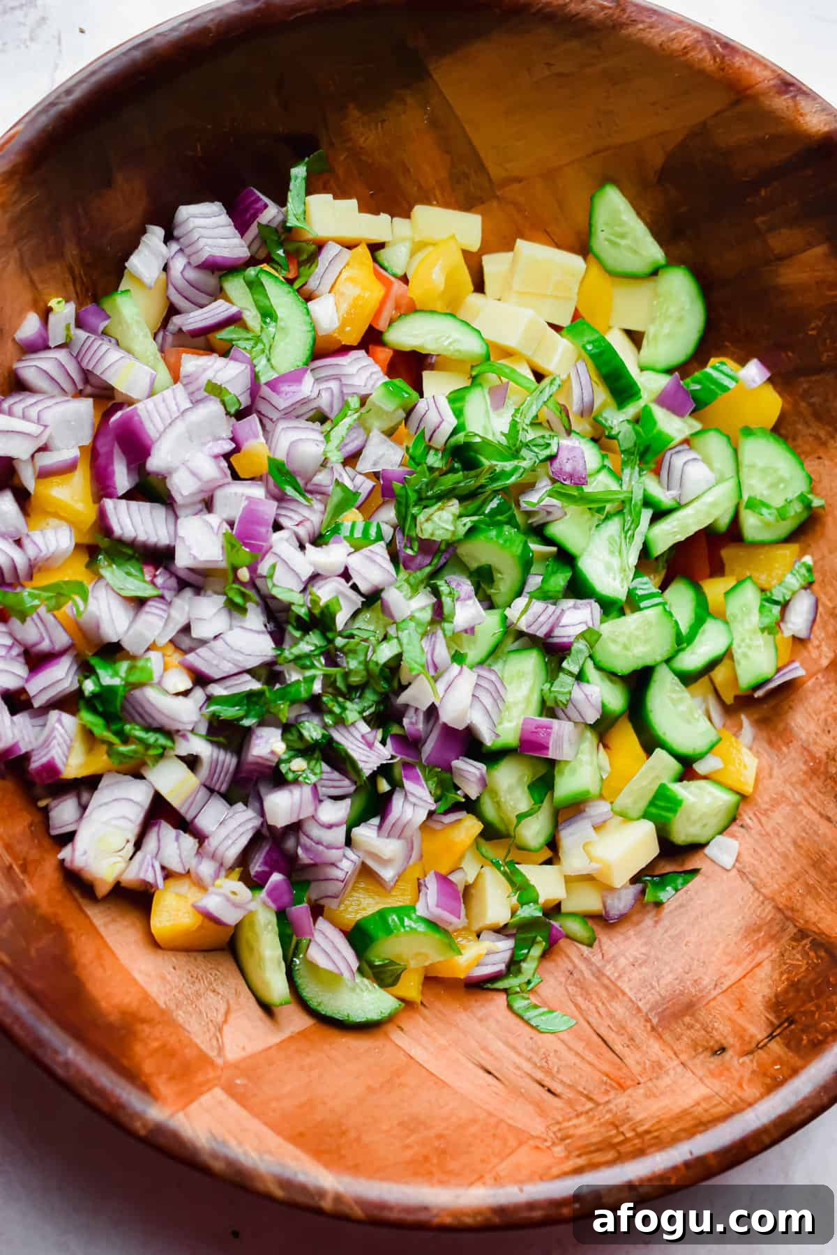 The ingredients are chopped and added to the bowl.