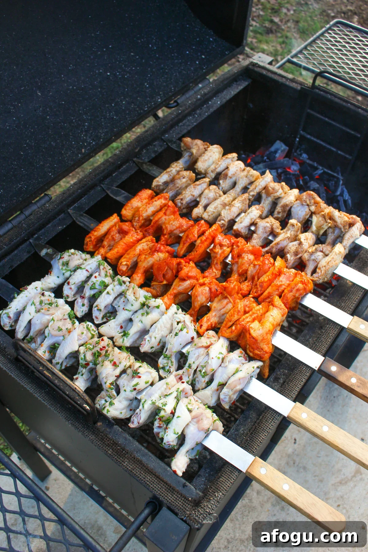Chicken Wing Skewers get set on the grill. 
