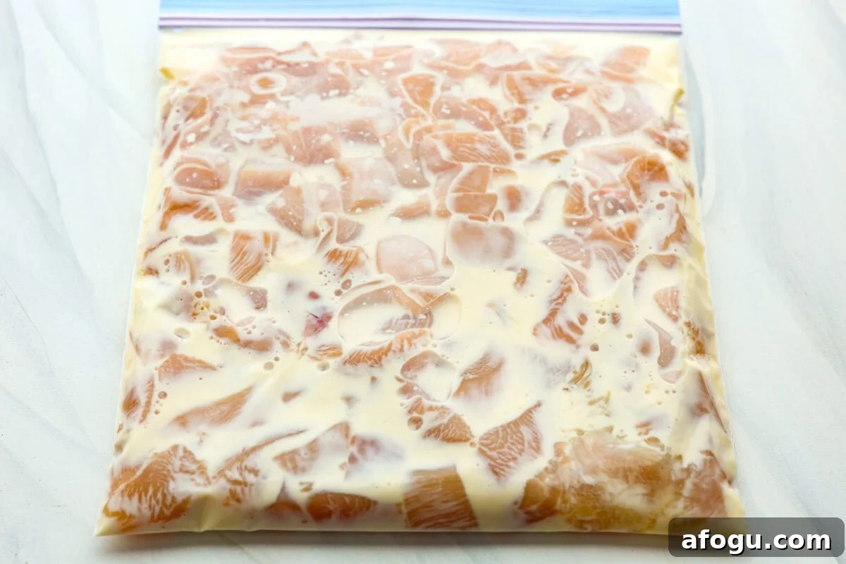 Chicken mixed with the marinade in a ziplock bag. 