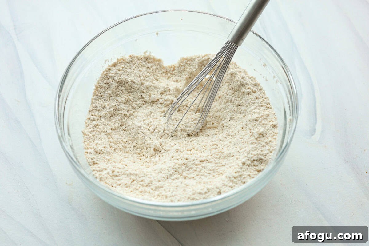 Dry ingredients combined in a glass bowl. 