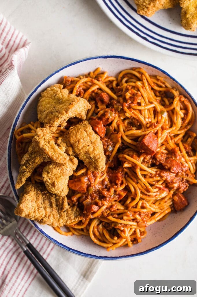 soul food spaghetti in a bowl (black folks spaghetti) with a side of catfish