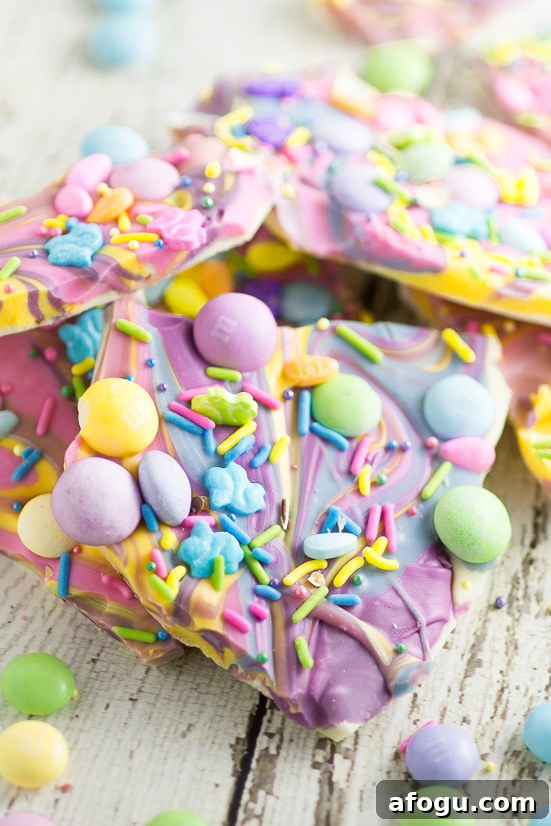 Creamy White Chocolate Easter Bark Recipe For Spring Treats 2 White Chocolate Easter Bark Recipe - Make this super easy, delicious, and adorable White Chocolate Easter Bark recipe in the microwave in just 20 minutes for a fun no bake Easter treat for kids.