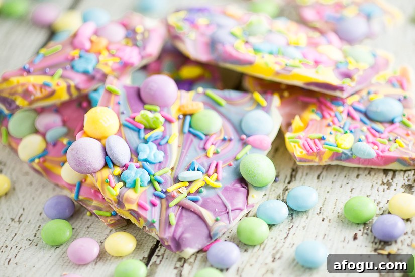 Creamy White Chocolate Easter Bark Recipe For Spring Treats 3 White Chocolate Easter Bark Recipe - Make this super easy, delicious, and adorable White Chocolate Easter Bark recipe in the microwave in just 20 minutes for a fun no bake Easter treat for kids.