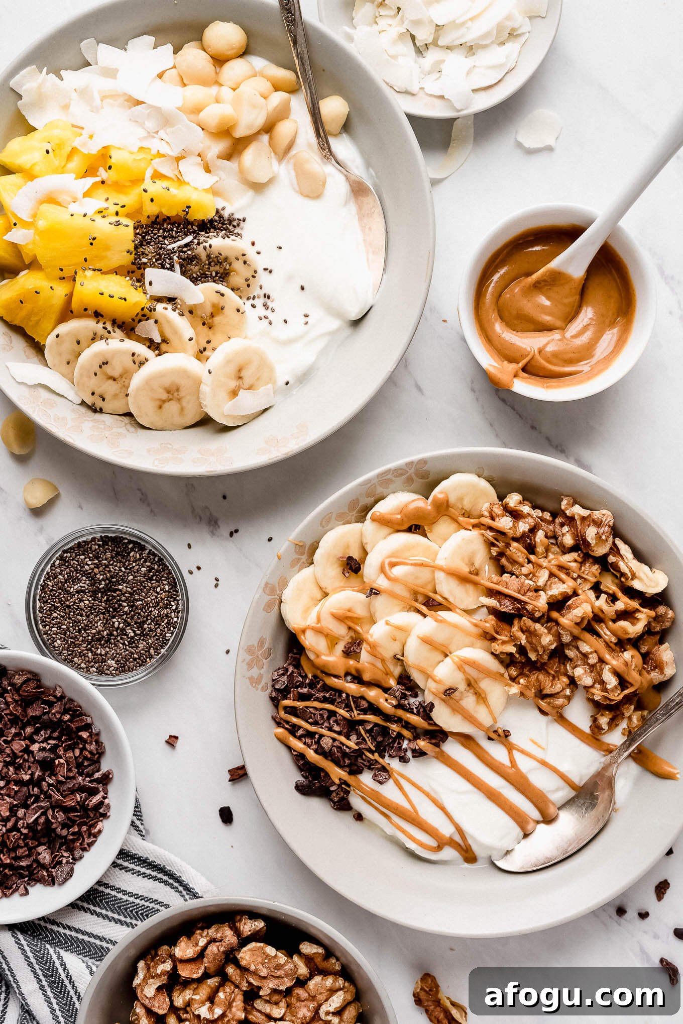 Tropical and Chunky Monkey bowls. A yogurt bowl with tropical toppings and a yogurt bowl with nuts, bananas, and chocolate.