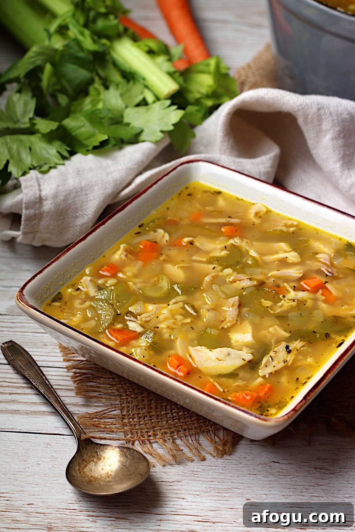 Leftover Rotisserie Chicken Noodle Soup Recipe for Quick Comfort 2 Homemade Leftover Rotisserie Chicken Noodle Soup in a square white bowl