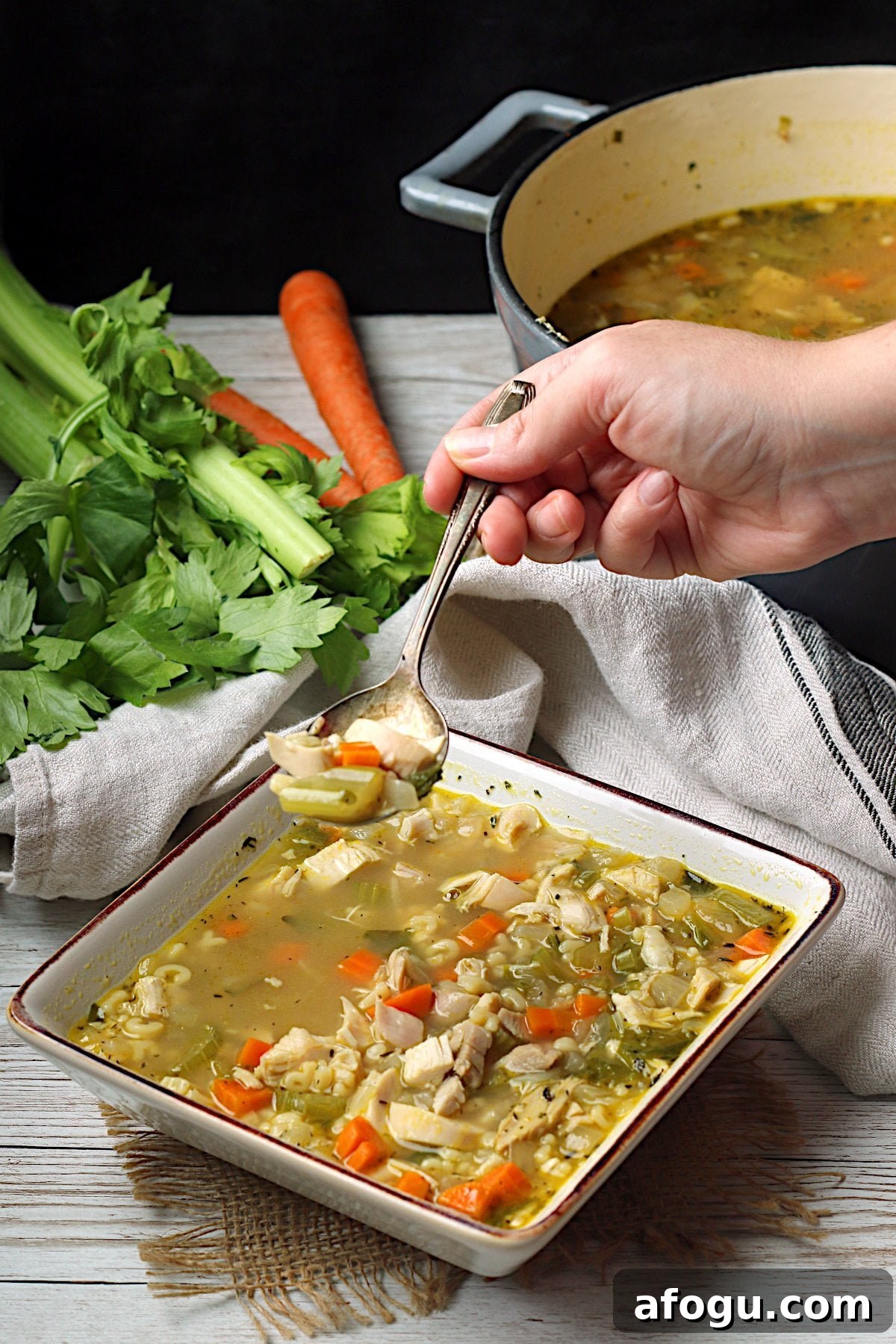 Leftover Rotisserie Chicken Noodle Soup Recipe for Quick Comfort 5 Homemade Leftover Rotisserie Chicken Noodle Soup in a square white bowl