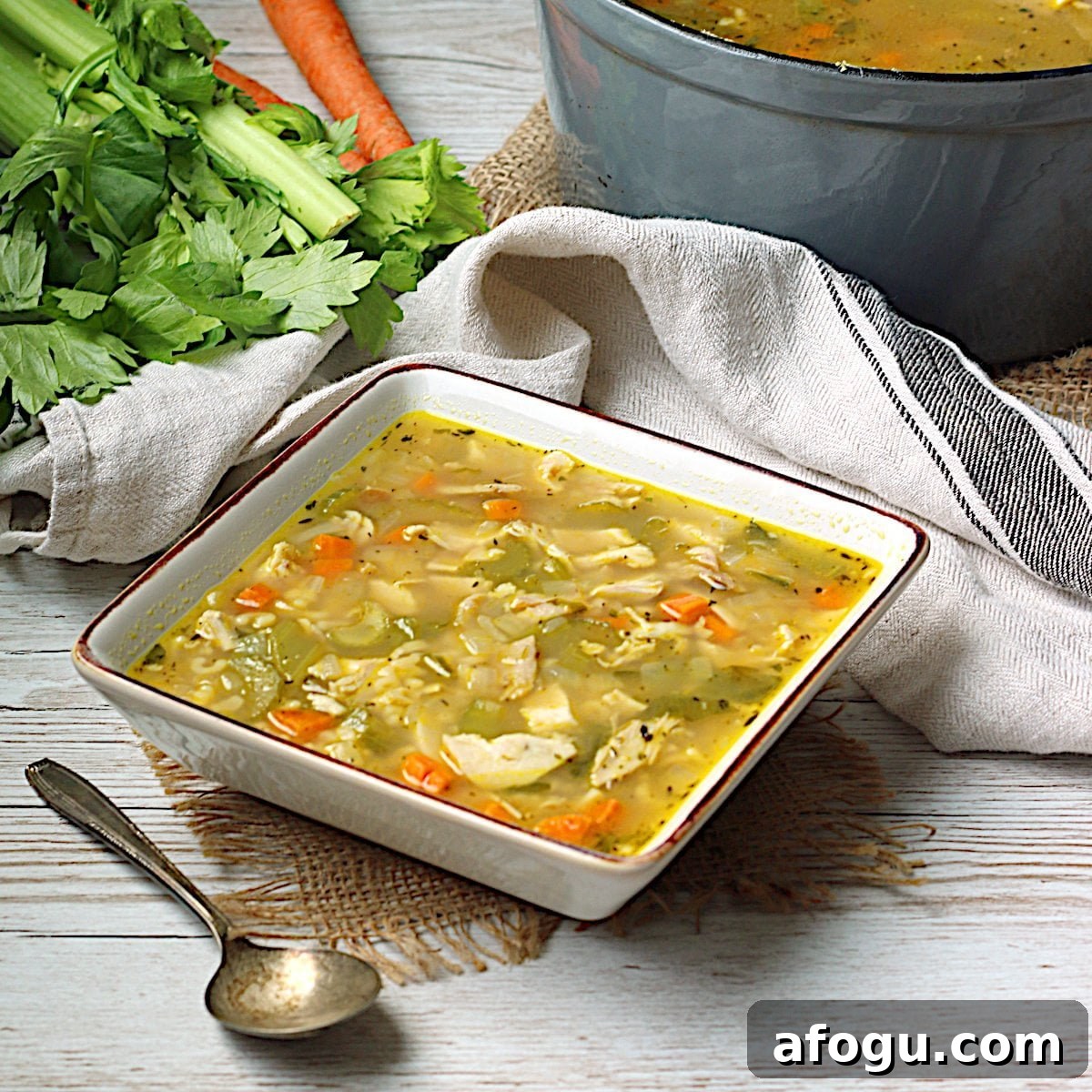 Leftover Rotisserie Chicken Noodle Soup Recipe for Quick Comfort 9 Homemade Leftover Rotisserie Chicken Noodle Soup in a square white bowl