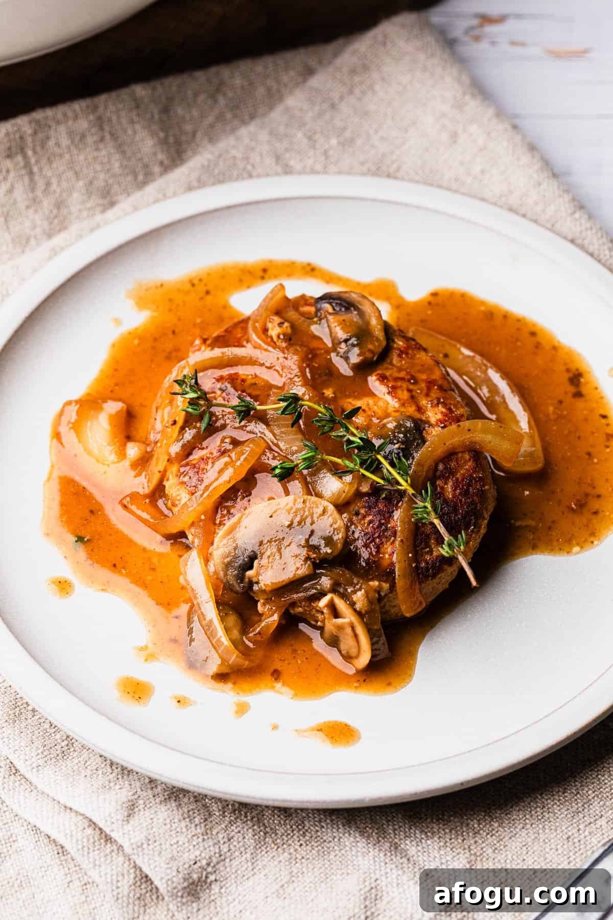 The completed turkey salisbury steak recipe on a plate.
