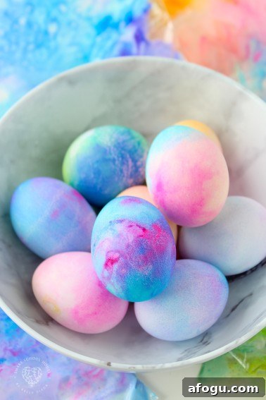 Whipped Cream Dyed Easter Eggs! Coloring Easter Eggs has never been easier! You only need two ingredients, whipped cream and food coloring!