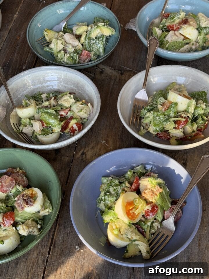 Creamy Chicken Cobb Salad Recipe with Avocado & Bacon 11 a photo of six bowls of chicken cobb salad