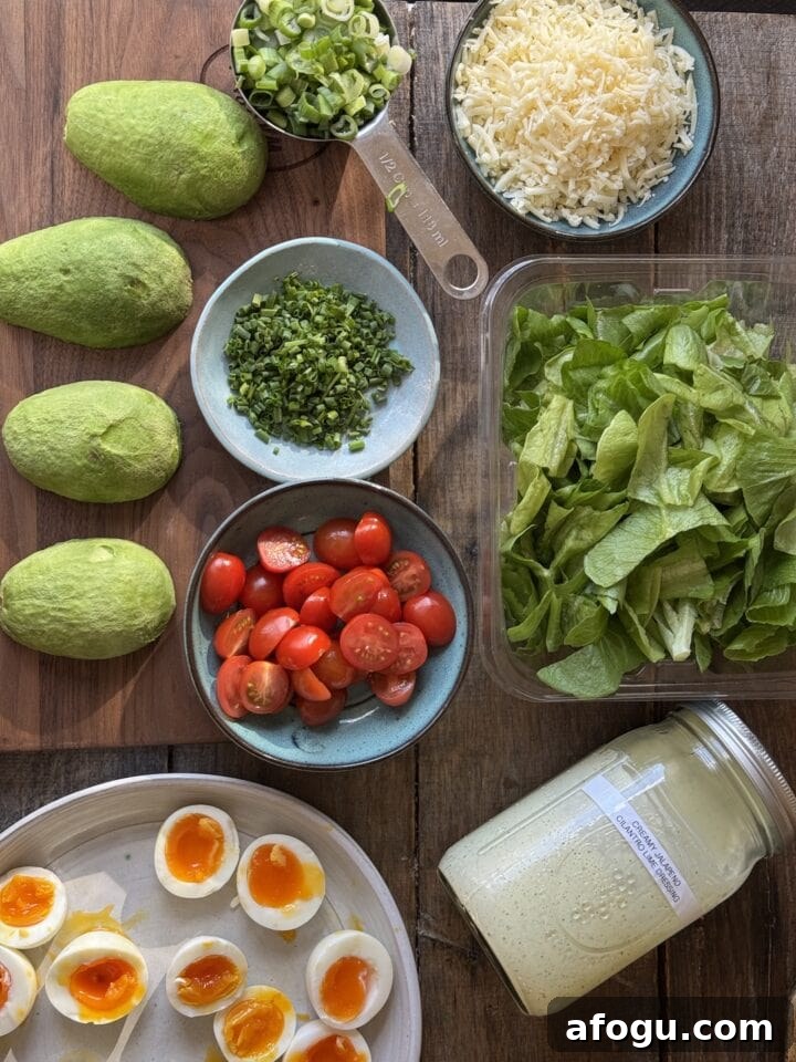 Creamy Chicken Cobb Salad Recipe with Avocado & Bacon 3 a photo of the ingredients for cobb salad