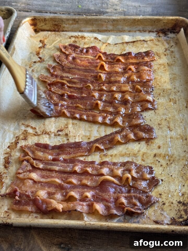 Creamy Chicken Cobb Salad Recipe with Avocado & Bacon 7 a photo of bacon cooked on a baking sheet