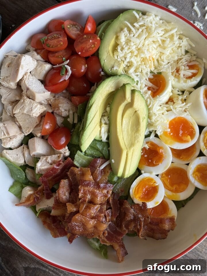 Creamy Chicken Cobb Salad Recipe with Avocado & Bacon 9 a photo of the salad assembled in a serving bowl