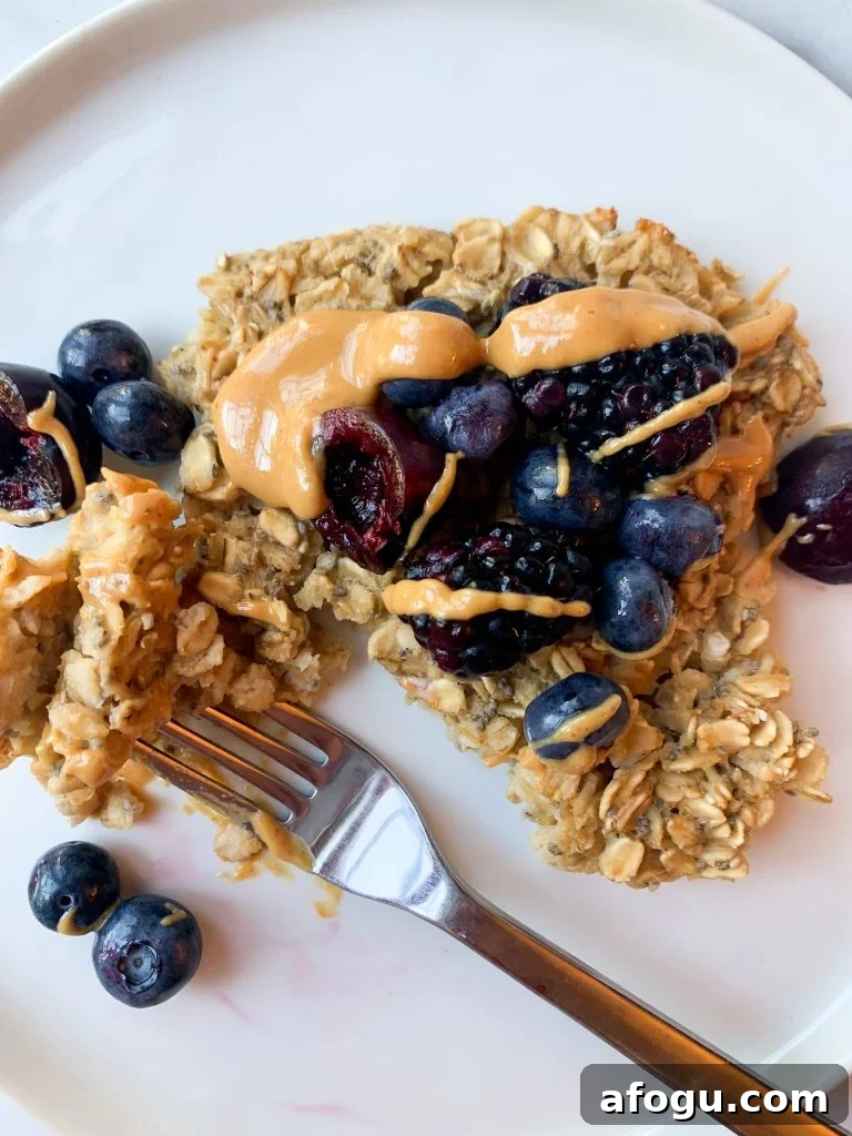 Chewy Baked Oatmeal with Berries and Cinnamon 3 baked oats topped with peanut butter and fresh fruit