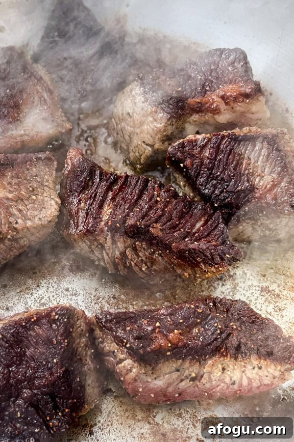 beef brisket browning in a skillet
