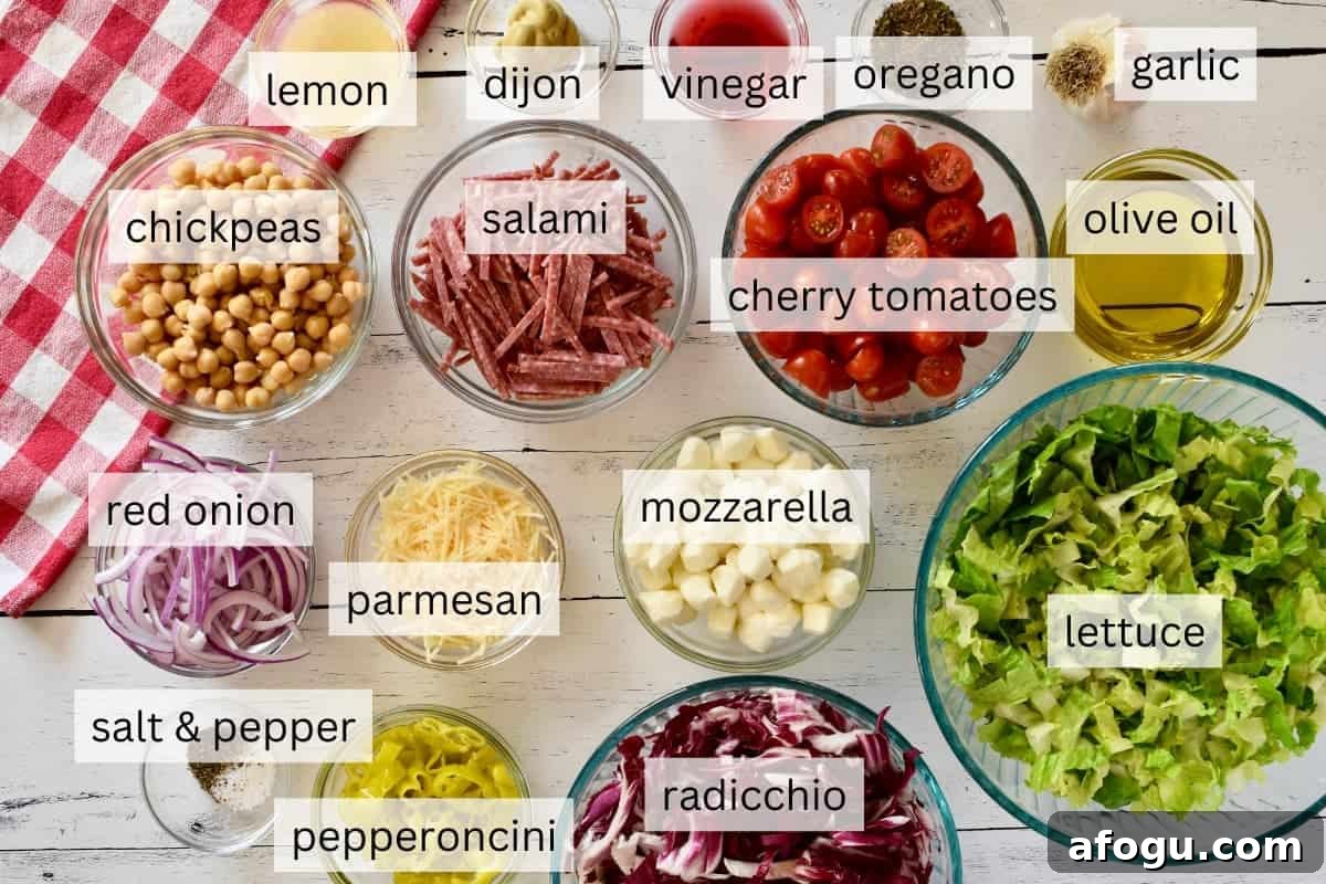 Ingredients for recipe include mozzarella, romaine lettuce, salami, pepperoncini, chickpeas, and cherry tomatoes. 