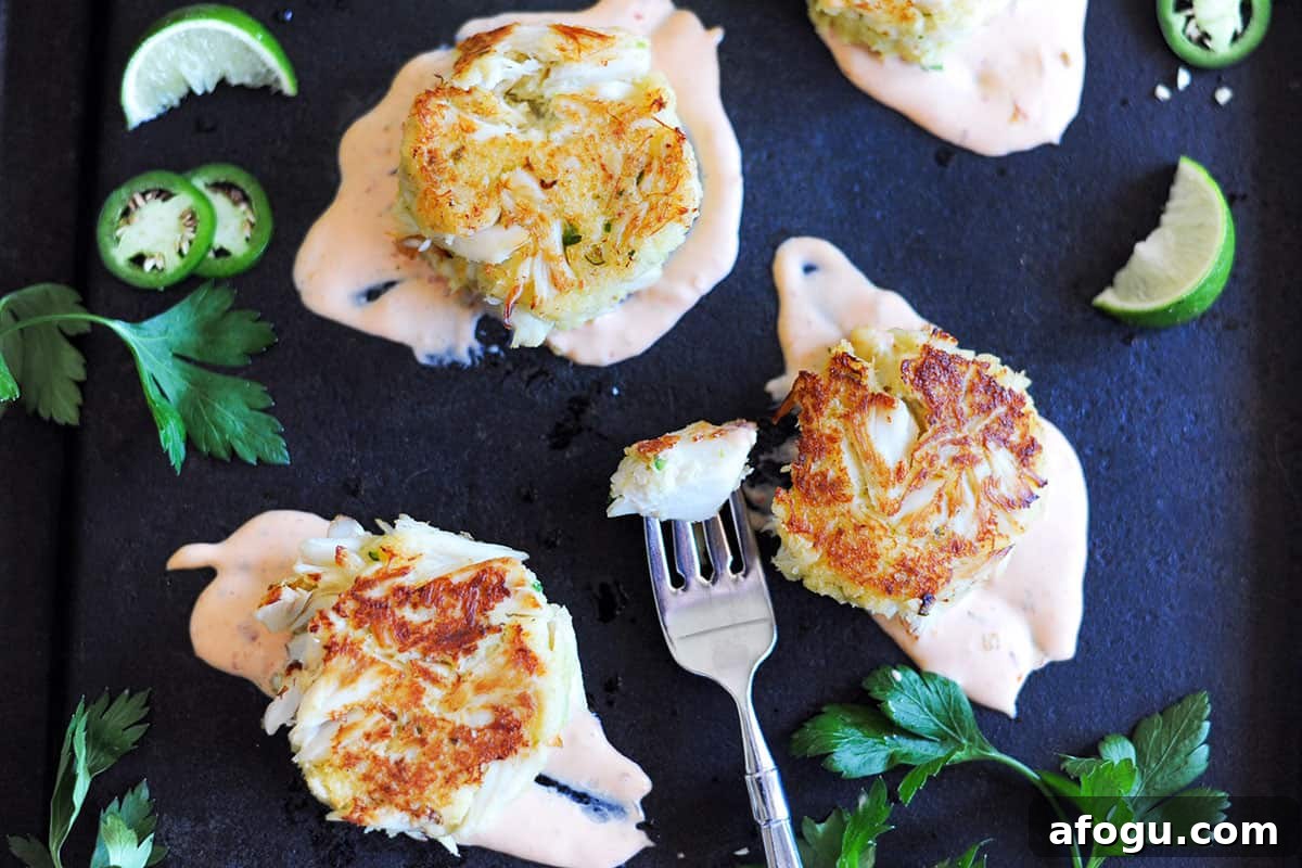 platter of crab cakes and herbs. 