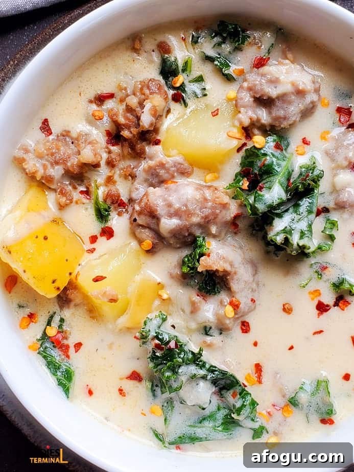 olive garden copycat instant pot zuppa toscana soup garnished with red pepper flakes