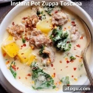 Instant Pot Zuppa Toscana soup served in white bowl with spoon