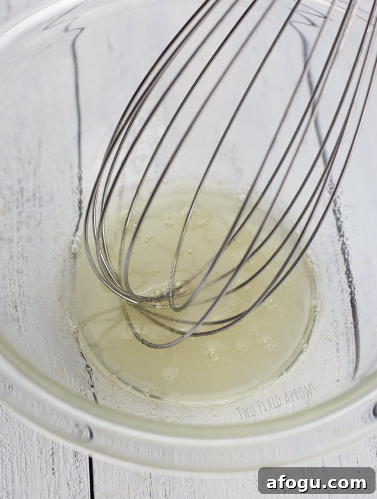Whisk the aquafaba liquid with sugar.