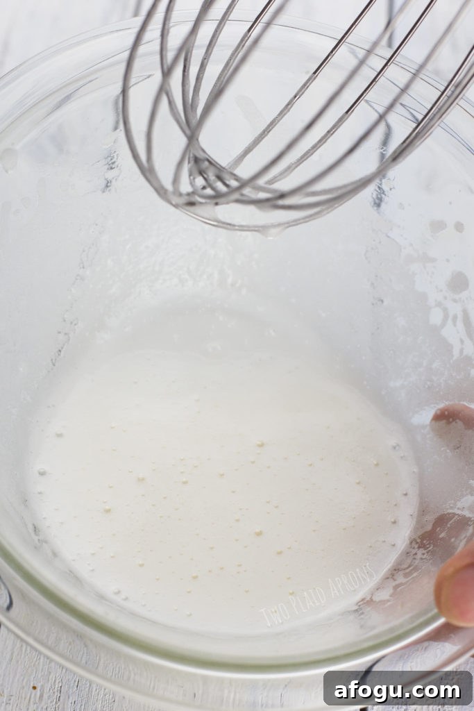 Mid stage of whisking aquafaba with sugar.