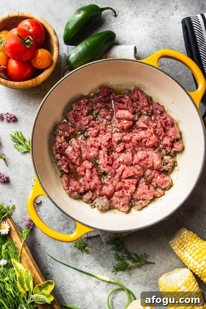 Skillet Ground Beef with Sweet Corn and Bell Peppers 4 Ground beef being cooked in skillet