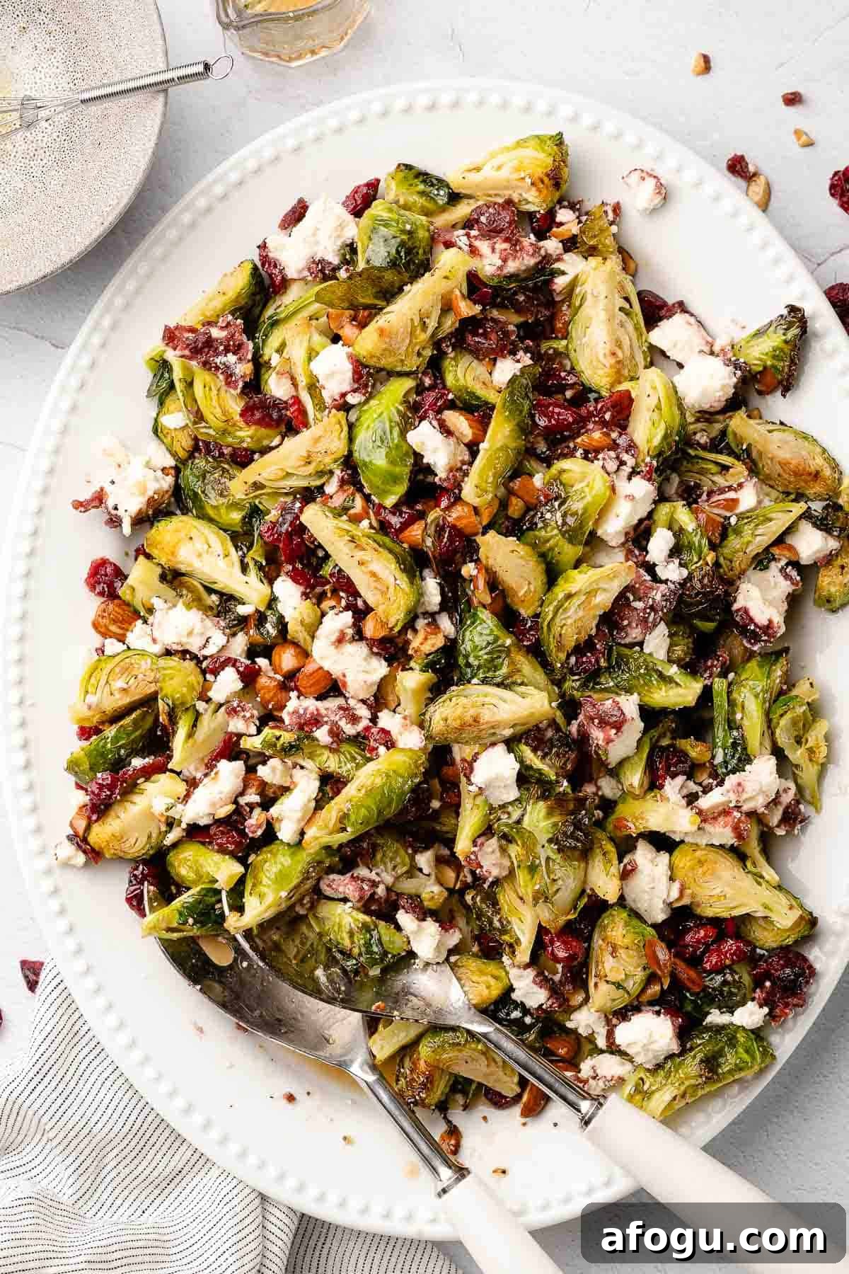 brussels sprouts salad with cranberries on large white platter