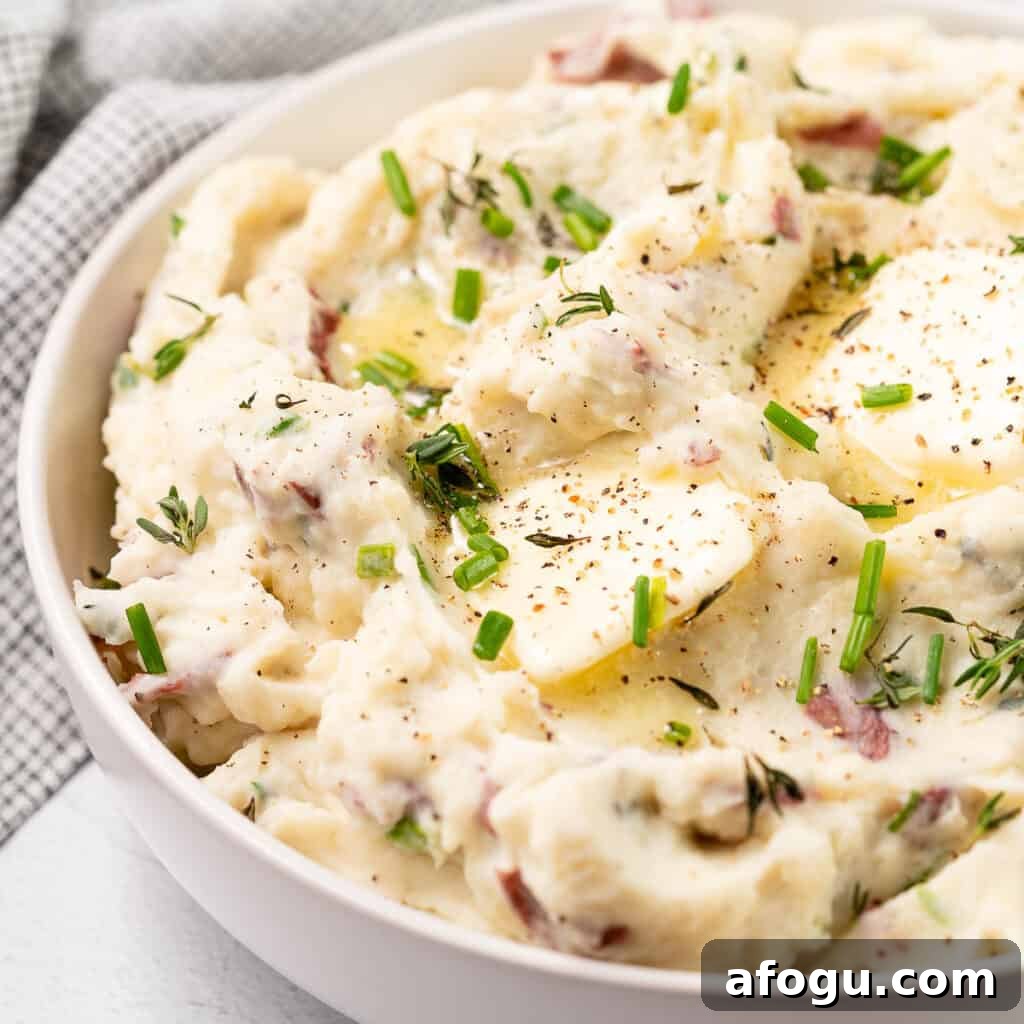mashed potatoes in bowl with butter on top