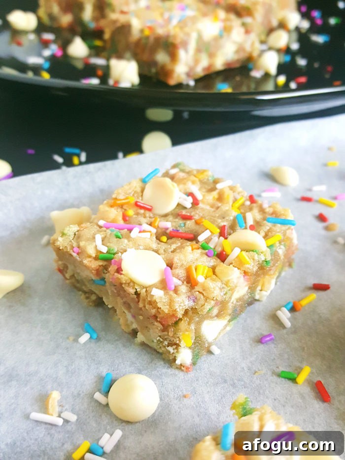 White Chocolate Chip Birthday Cake Batter Blondies - If you love eating cake batter and are a sucker for cookie dough then you will absolutely love these Blondies. No mixer required, one bowl, and they’re ready in less than 30 minutes!