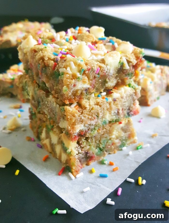 White Chocolate Chip Birthday Cake Batter Blondies - If you love eating cake batter and are a sucker for cookie dough then you will absolutely love these Blondies. No mixer required, one bowl, and they’re ready in less than 30 minutes!