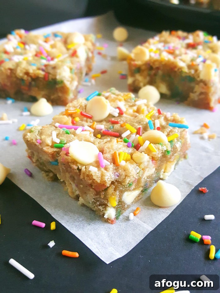 White Chocolate Chip Birthday Cake Batter Blondies - If you love eating cake batter and are a sucker for cookie dough then you will absolutely love these Blondies. No mixer required, one bowl, and they’re ready in less than 30 minutes!