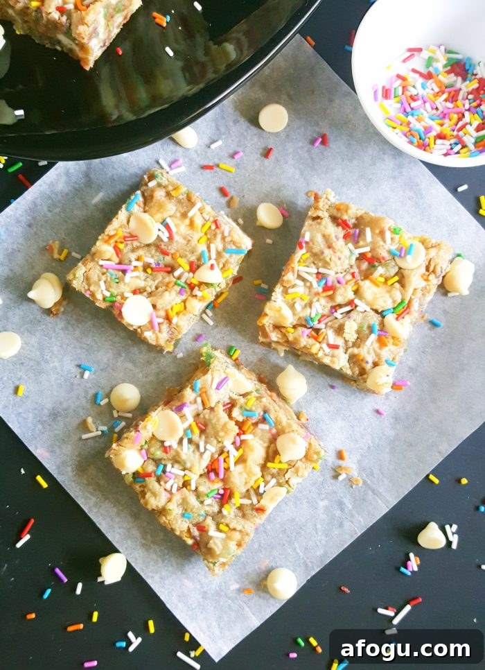 White Chocolate Chip Birthday Cake Batter Blondies - If you love eating cake batter and are a sucker for cookie dough then you will absolutely love these Blondies. No mixer required, one bowl, and they’re ready in less than 30 minutes!