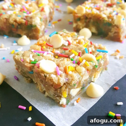 White Chocolate Chip Birthday Cake Batter Blondies - If you love eating cake batter and are a sucker for cookie dough then you will absolutely love these Blondies. No mixer required, one bowl, and they’re ready in less than 30 minutes!