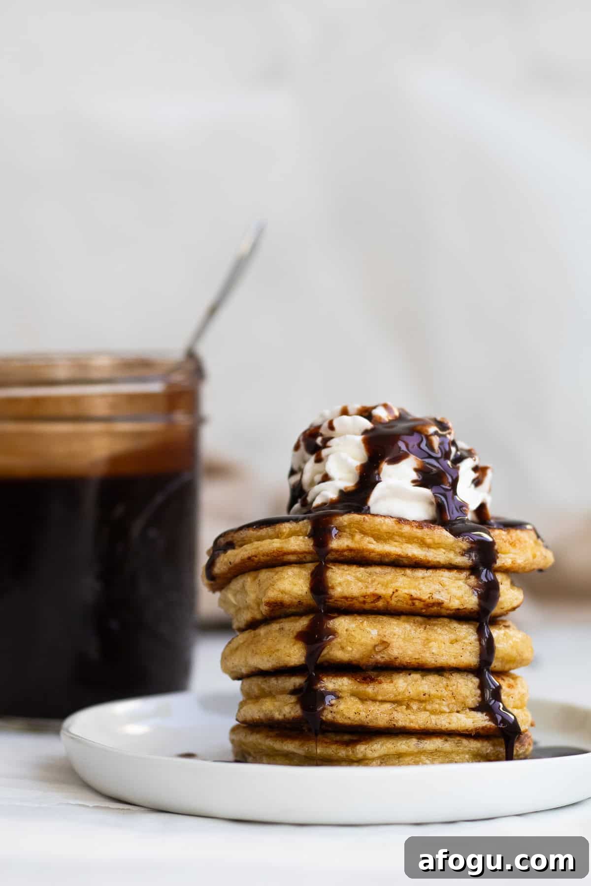 6-Ingredient Cottage Cheese Oatmeal Pancakes Recipe 10 pancakes with whipped cream and chocolate syrup